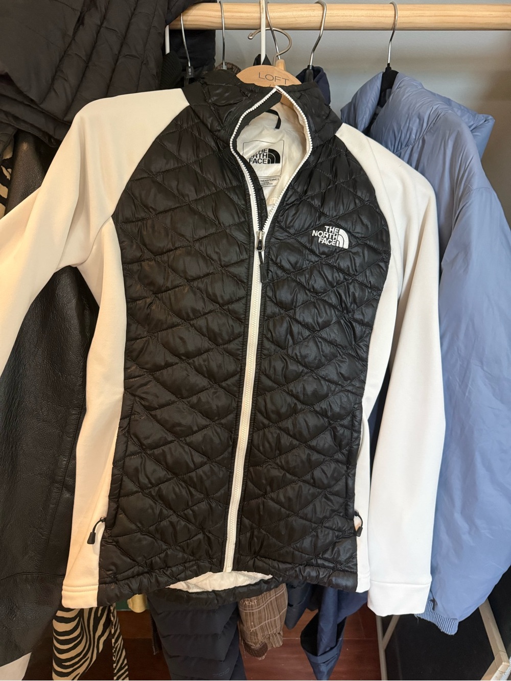 The North Face Women's Black Quilted Puffer Jacket with White Sleeves